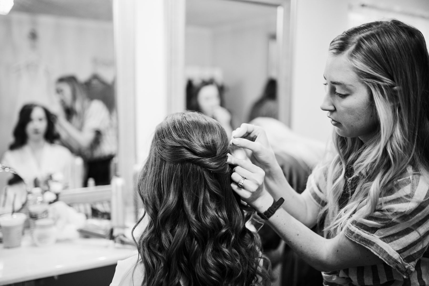 Bride getting her hair done before a A Rustic Wedding at Barn in the Bend in Nashville, Tennessee