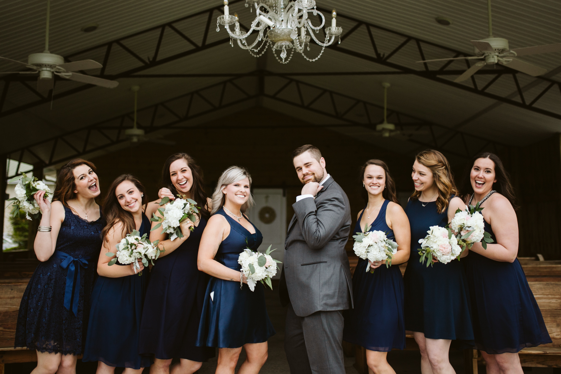 Groom with the bridesmaids before A Rustic Wedding at Barn in the Bend in Nashville, Tennessee