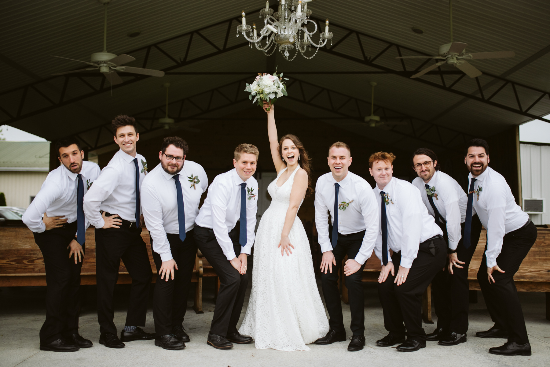 Bride with the groomsmen before A Rustic Wedding at Barn in the Bend in Nashville, Tennessee