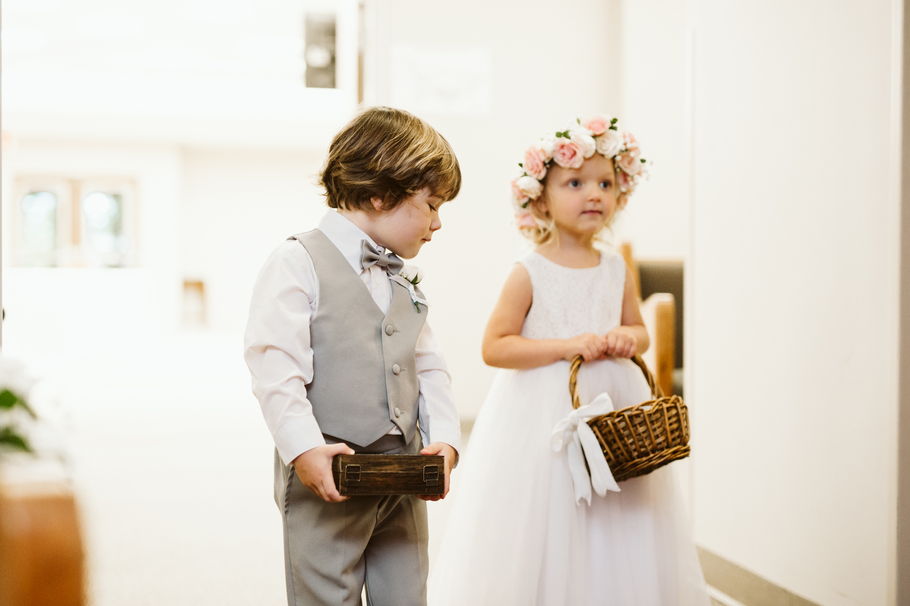 ring bearer and flower girl at a rainy summer wedding at brentwood hills church in Nashville, tennessee