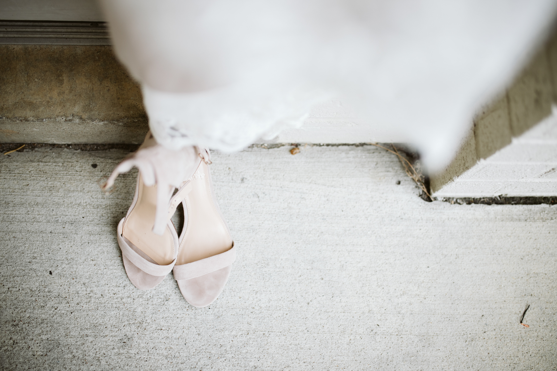 Wedding dress and shoes displayed at a rainy summer wedding at brentwood hills church in Nashville, tennessee