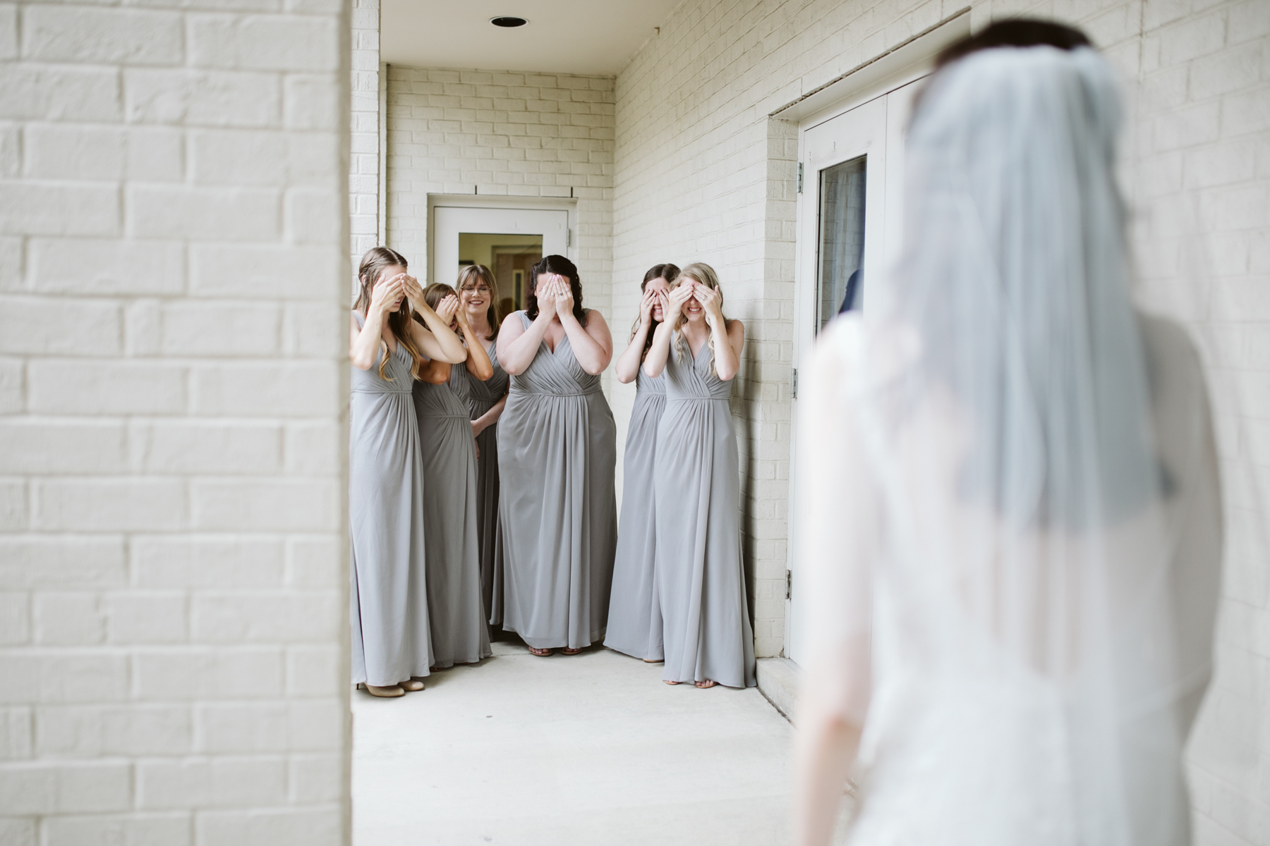 bridesmaid reveal before a rainy summer wedding at brentwood hills church in Nashville, tennessee