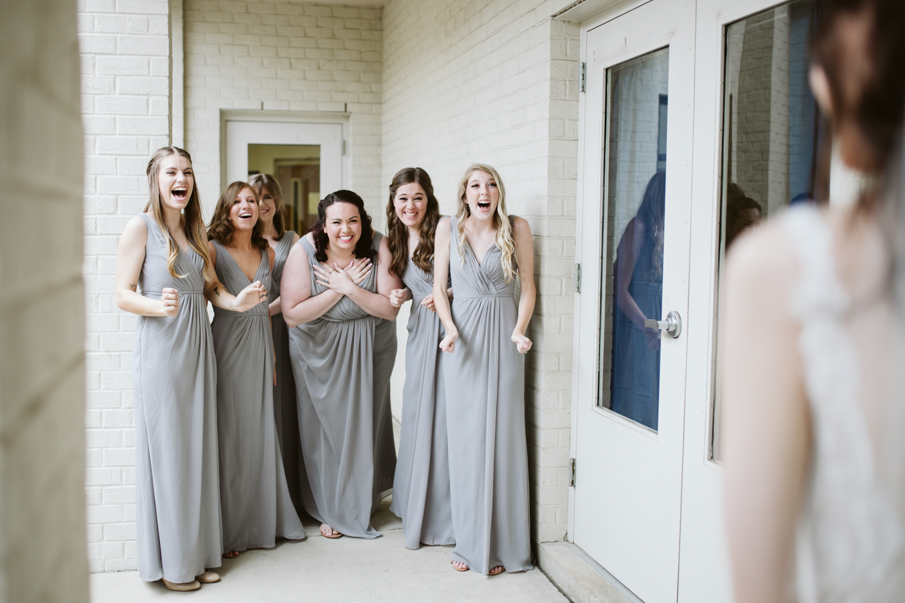 the sweetest bridesmaids reveal before a rainy summer wedding at brentwood hills church in Nashville, tennessee