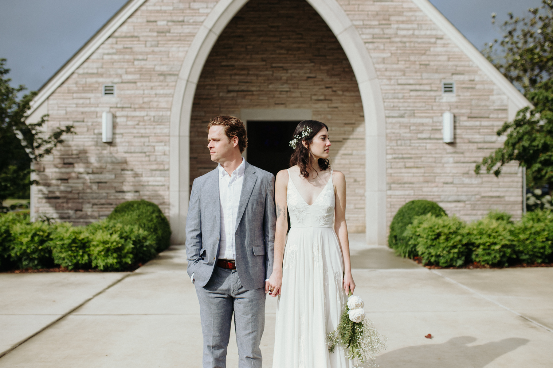 Bride and groom outside of lakeshore chapel before their downtown knoxville wedding at redeemer church