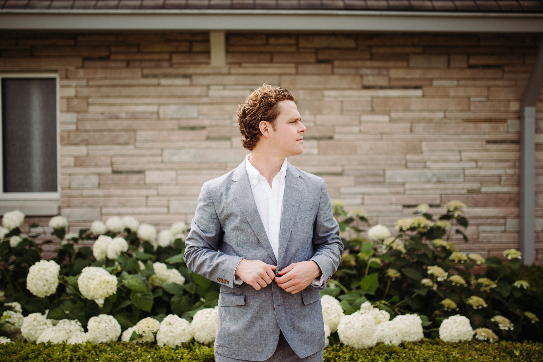 Groom's portraits outside of Lakeshore Chapel before his downtown knoxville wedding at redeemer church
