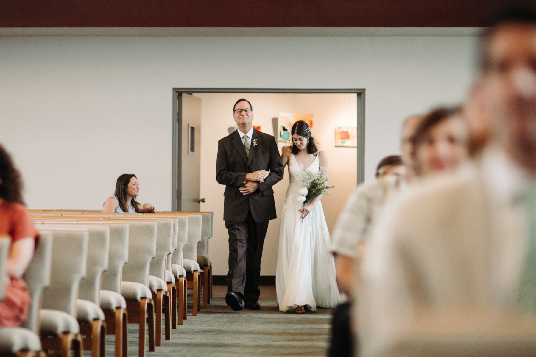 Father and daughter walking down the aisle at a downtown knoxville wedding at redeemer church