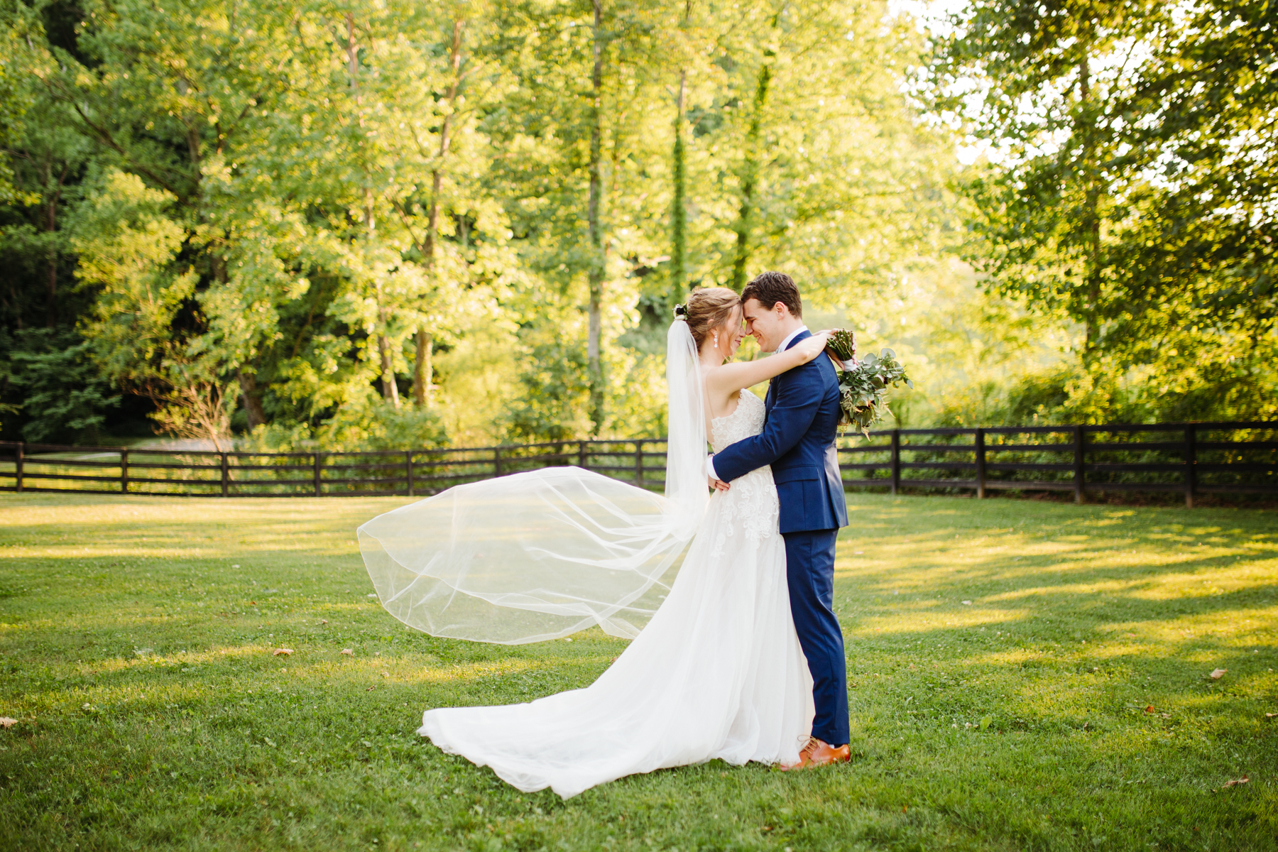 Bridal portraits with a gorgeous veil at a stables at strawberry creek wedding in Knoxville, tennessee
