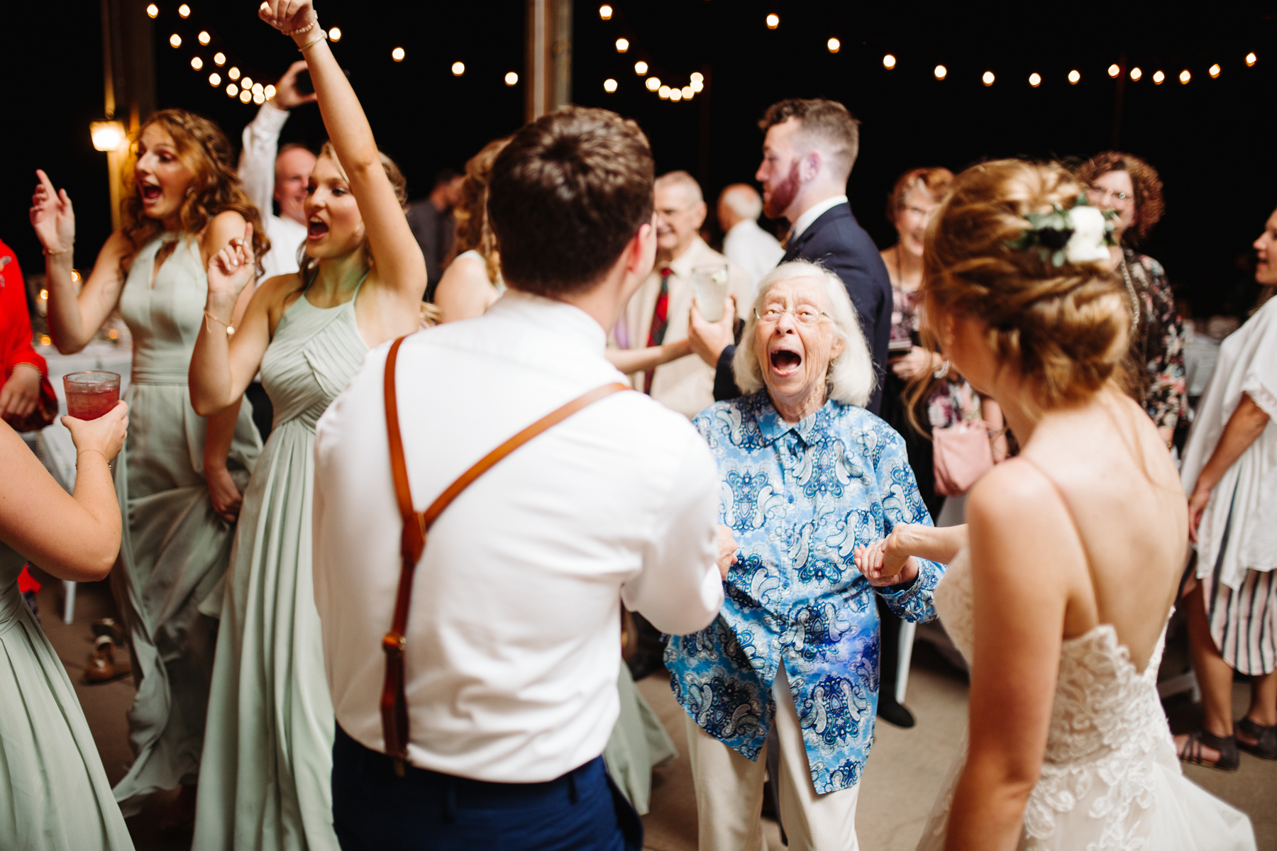 Grandmother of the bride dancing at a stables at strawberry creek wedding in knoxville, tennessee