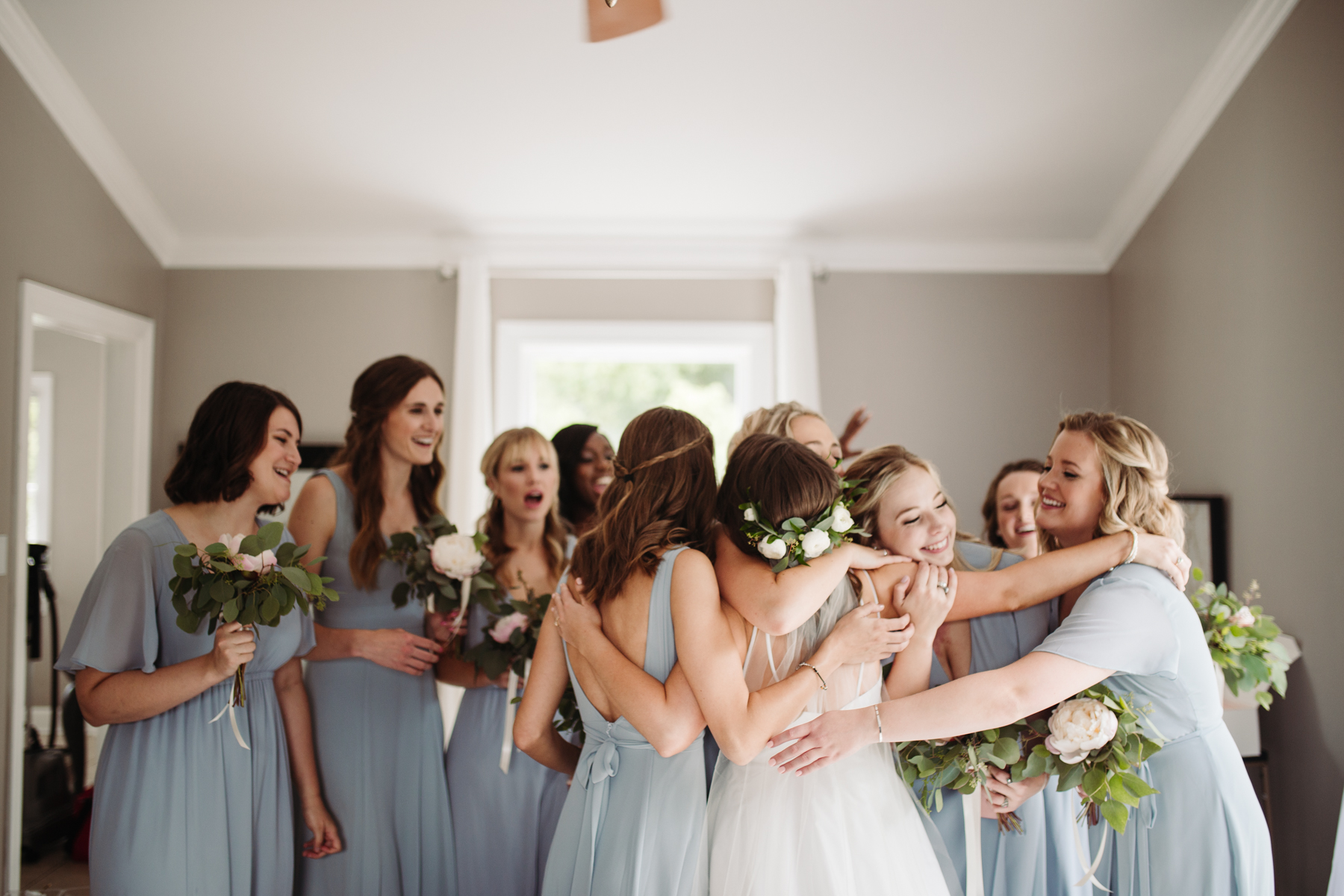 Bridesmaids reveal before a Sunny summer wedding at Dara's Garden in Knoxville, Tennessee 