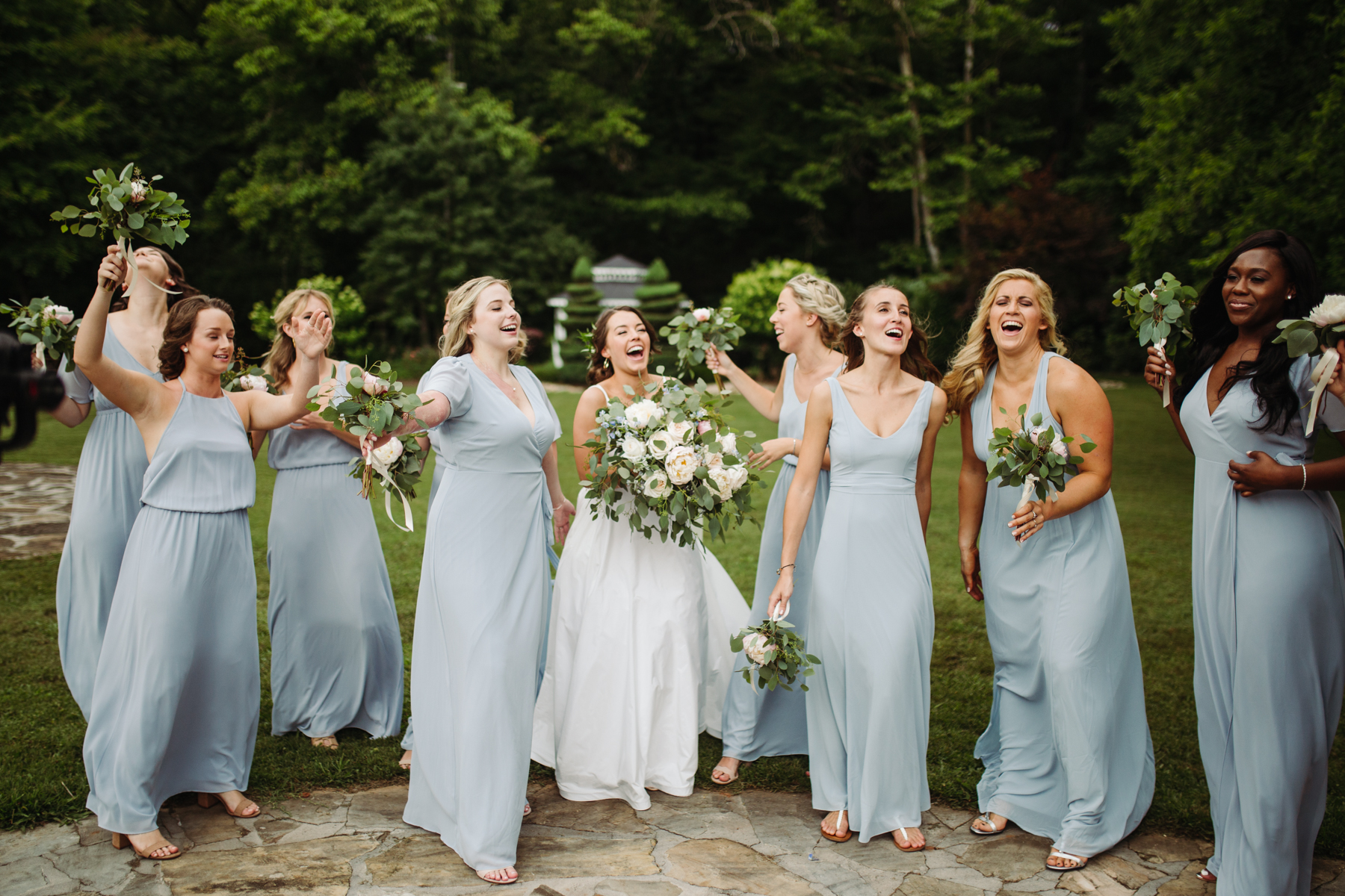 Bride and bridesmaid photos at a Sunny summer wedding at Dara's Garden in Knoxville, Tennessee 