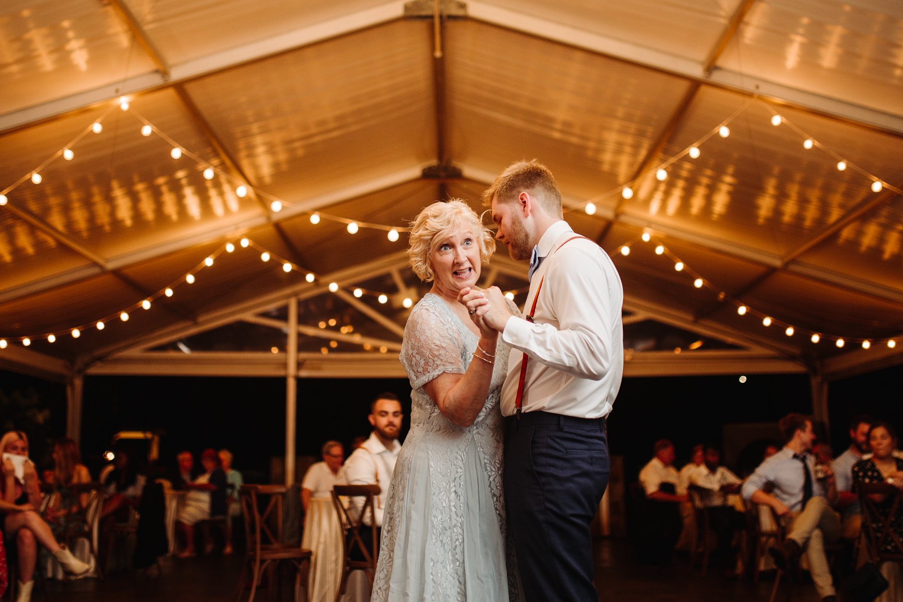 mother son dance during the reception of a Sunny summer wedding at Dara's Garden in Knoxville, Tennessee 