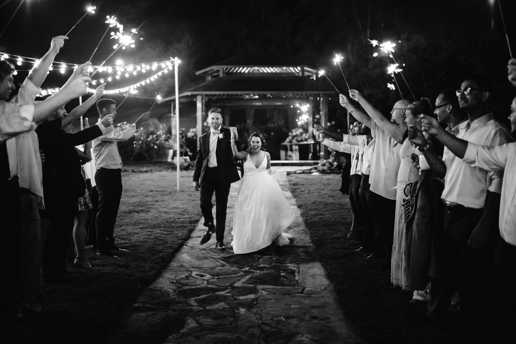 Sparkler exit from a reception of a Sunny summer wedding at Dara's Garden in Knoxville, Tennessee