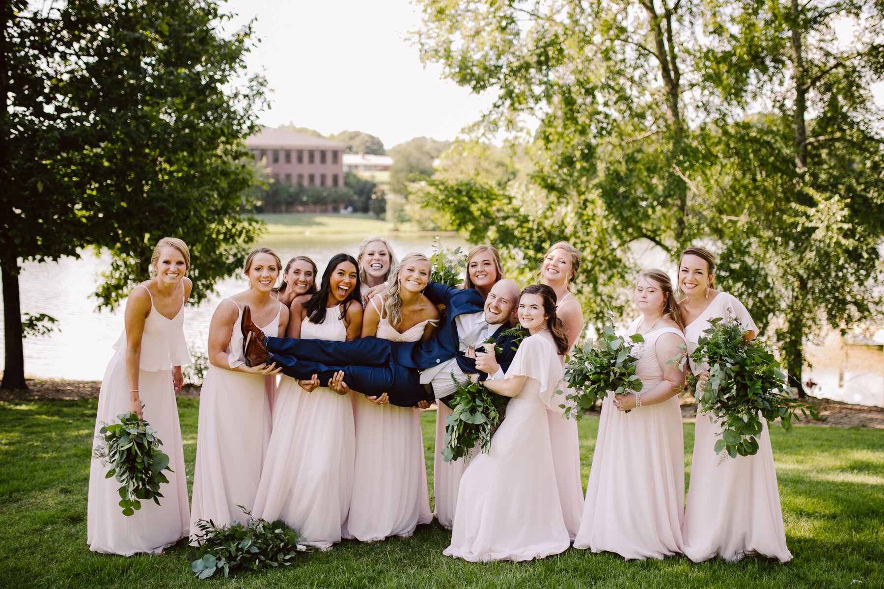 bridal party photos before a sunny outdoor wedding at hunter valley farms in knoxville tennessee