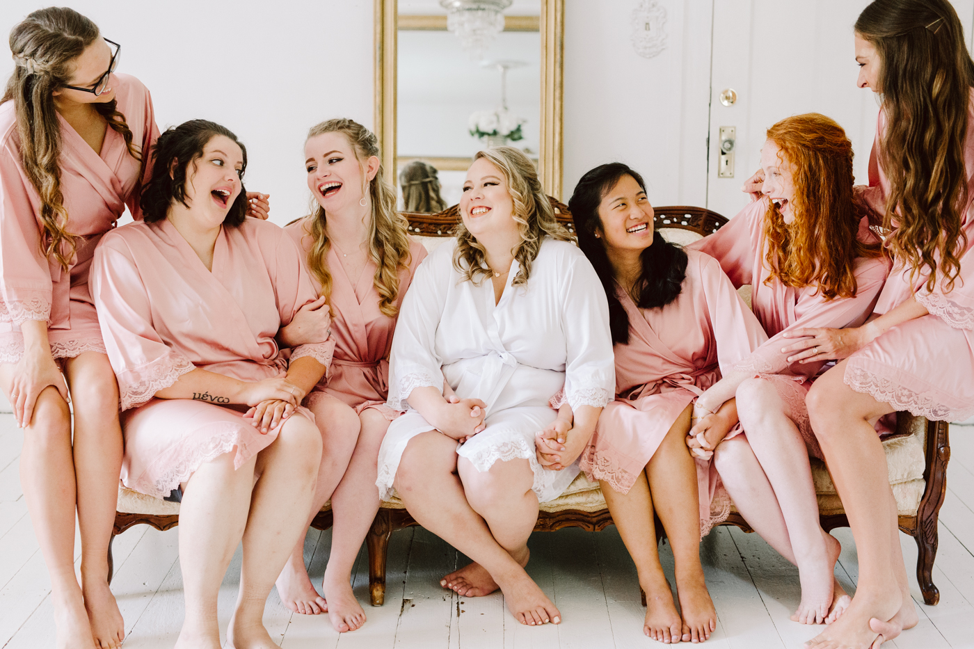 bridesmaid portraits in the suite before a sunny summer wedding at the venue at twin oaks in tennessee